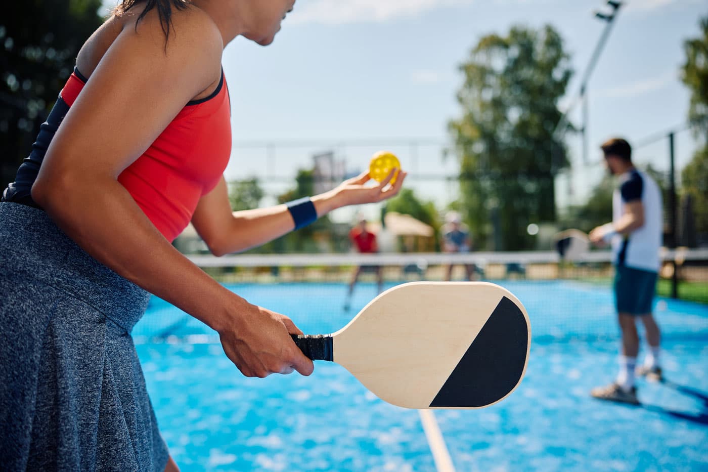 Members playing pickleball at a premium club